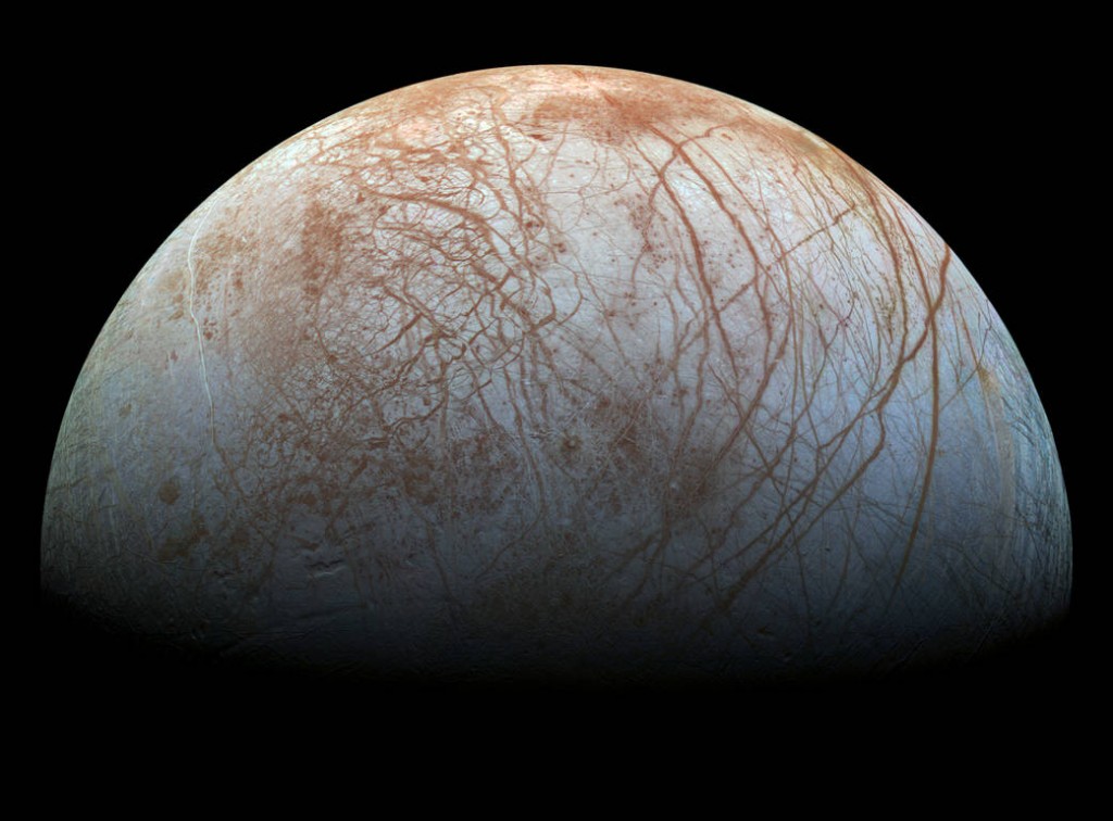 Realistic color image of Europa constructed from mosaic of images taken by NASA's Galileo Probe.  Surface is mostly water ice with red-brown cracks and ridges containing significant amounts of other materials.  Image courtesy of NASA/JPL-Caltech/SETI Institute.